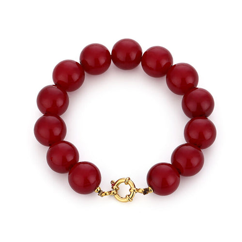 Kralen armband burgundy (bordeaux) met goudkleurig stainless steel detail. Damesarmband.