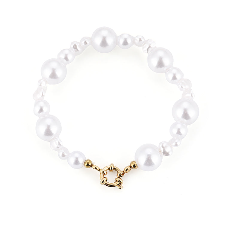 Flexibele parel armband met goudkleurig RVS detail voor dames