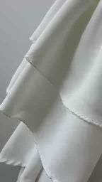 Witte oversized blouse - strik en dubbele ruches